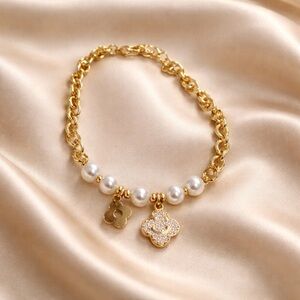 Gold Pearl Charm Bracelet with Clover Pendants